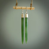 These are stunning large wing shaped drop jade earrings carved in New Zealand by Josey Coyle. It is carved from a deep green piece of New Zealand Jade and with Sterling Silver hooks and findings.